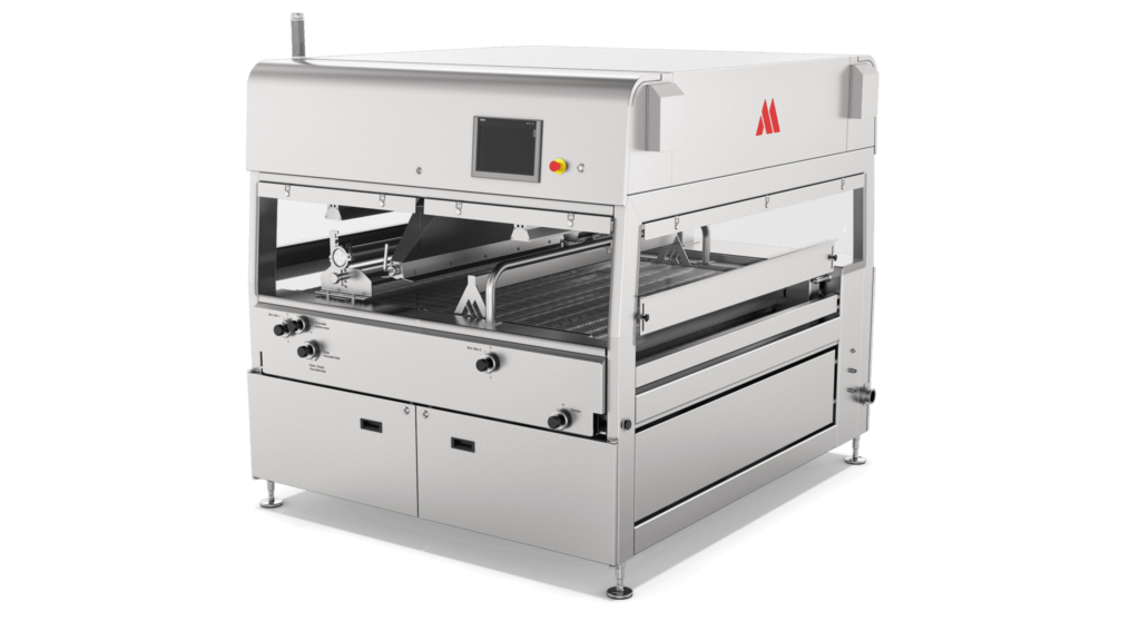 Aasted Nielsen Master Enrober, engineered for precision chocolate coating, ensuring seamless enrobing of confectionery products with a consistent and high-quality finish